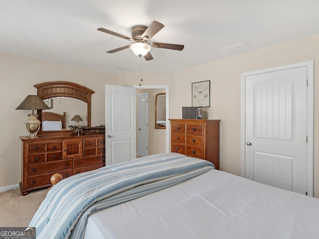 bedroom with ceiling fan and light carpet