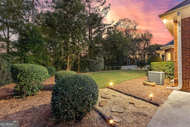 yard at dusk with cooling unit