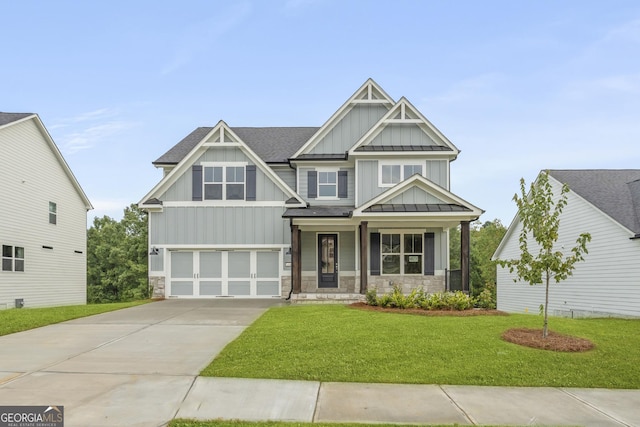 craftsman house featuring covered porch, a garage, and a front lawn