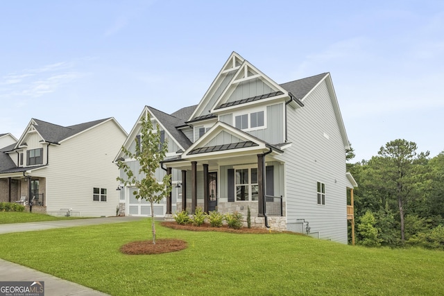 craftsman-style home with covered porch and a front yard