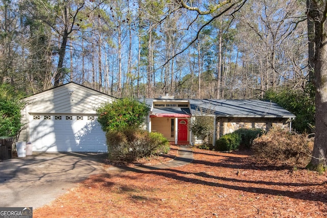 ranch-style home featuring a garage