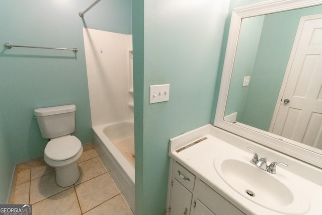 bathroom with vanity, toilet, tile patterned flooring, and a shower