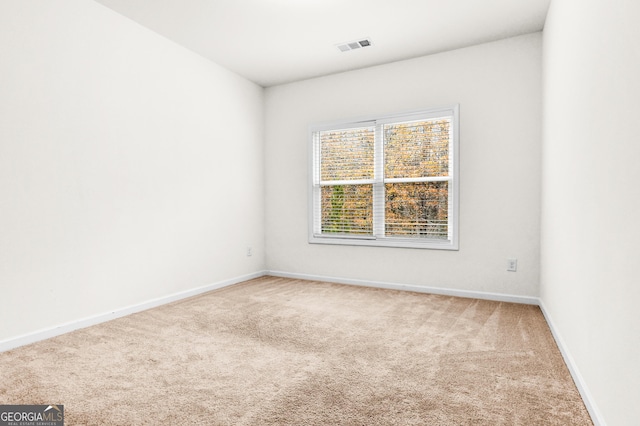 empty room featuring carpet floors