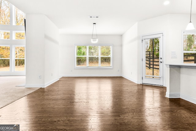 unfurnished dining area with dark hardwood / wood-style flooring