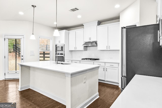 kitchen featuring pendant lighting, sink, an island with sink, appliances with stainless steel finishes, and white cabinetry