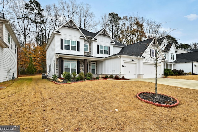 view of front of property with a front lawn and a garage