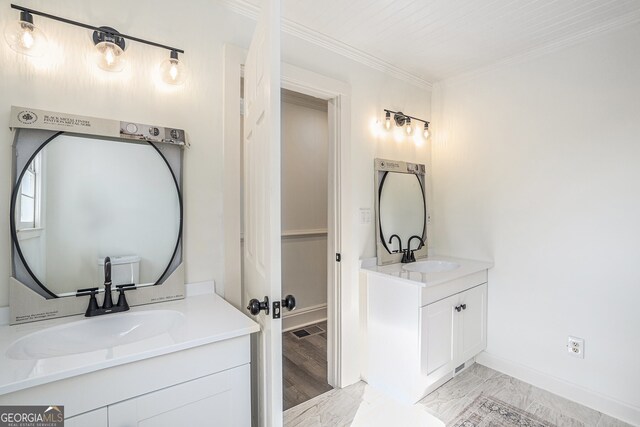 bathroom featuring vanity and ornamental molding