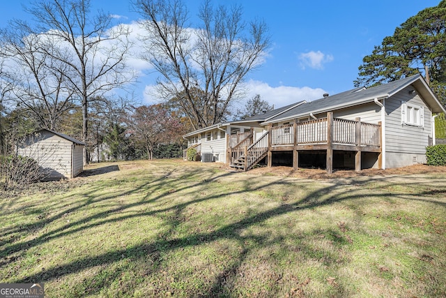 view of yard with a deck and a storage shed