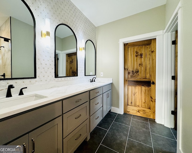 bathroom featuring tile patterned flooring and vanity