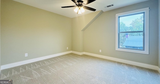 bonus room featuring ceiling fan and light colored carpet