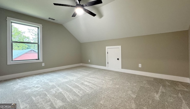 bonus room featuring ceiling fan, lofted ceiling, and light carpet