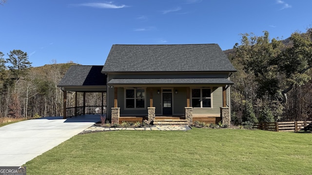 view of front of property featuring a carport, a porch, and a front yard