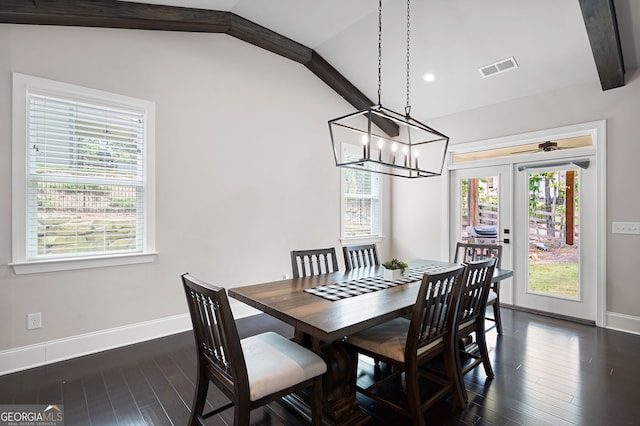 dining room with french doors, dark hardwood / wood-style flooring, lofted ceiling, and a notable chandelier