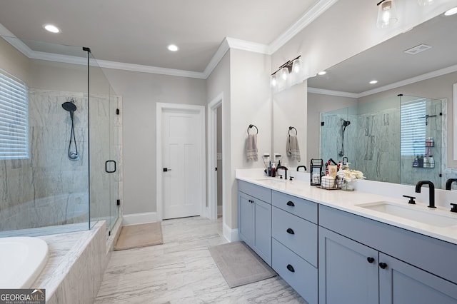 bathroom featuring crown molding, vanity, and shower with separate bathtub