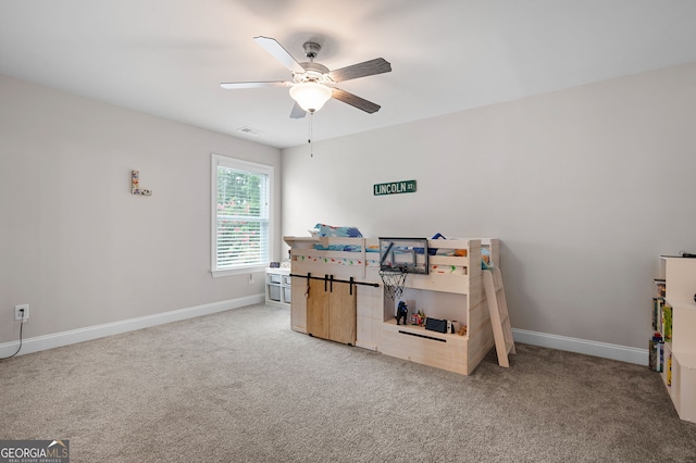 carpeted bedroom with ceiling fan