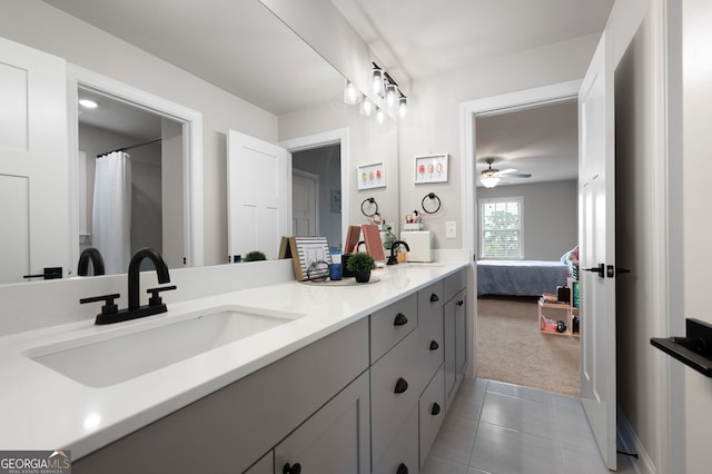 bathroom featuring tile patterned flooring, vanity, and ceiling fan