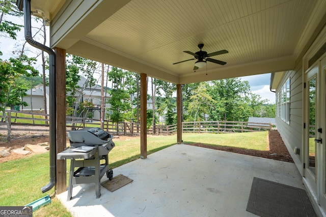 view of patio with ceiling fan and area for grilling