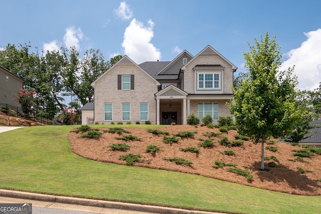 craftsman inspired home featuring a front yard