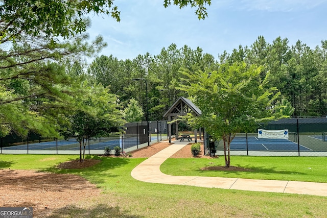 view of home's community with a lawn, a gazebo, and tennis court