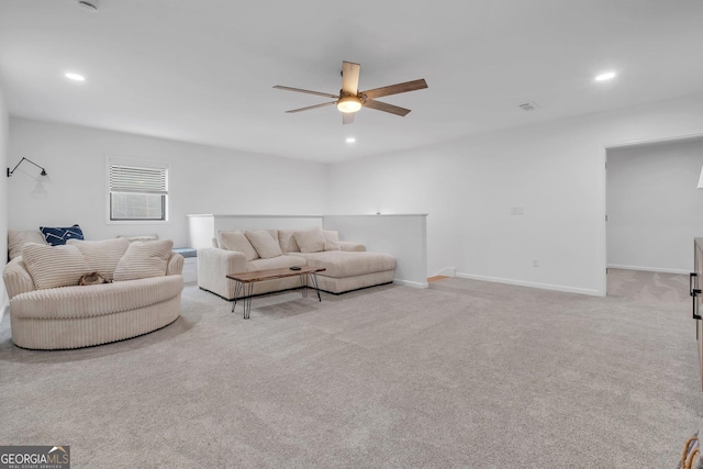 living room featuring light carpet and ceiling fan