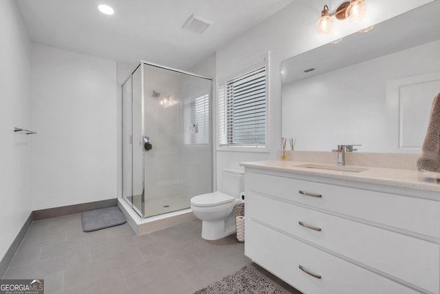 bathroom featuring tile patterned flooring, vanity, toilet, and an enclosed shower