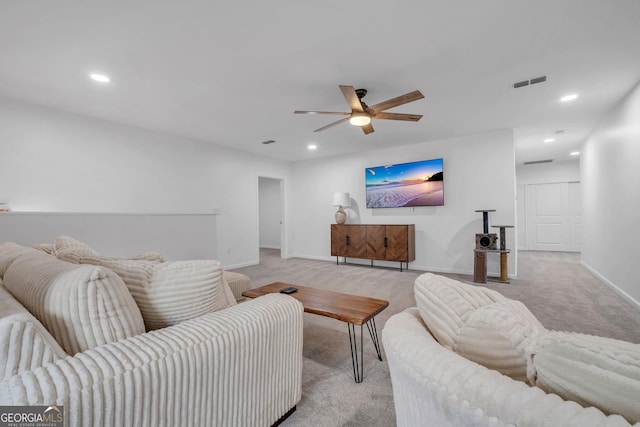 living room featuring light carpet and ceiling fan