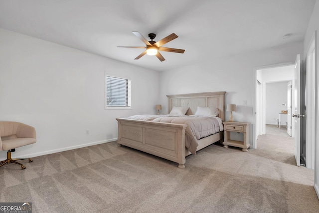 bedroom featuring ceiling fan and light colored carpet