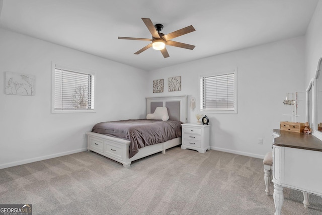 bedroom featuring ceiling fan and light carpet