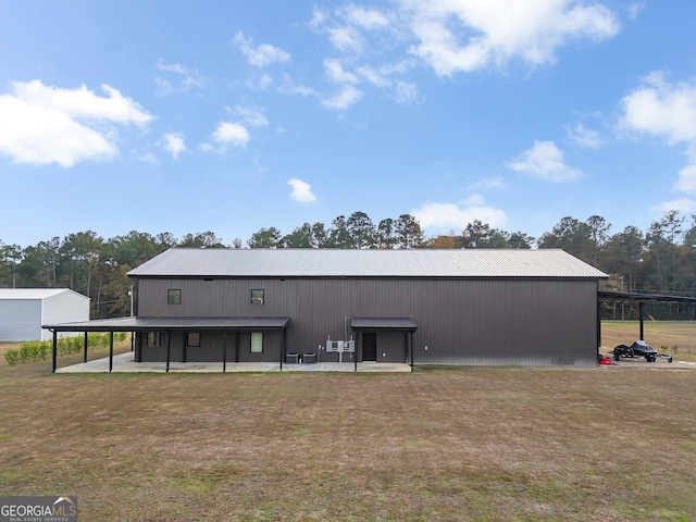 exterior space with a lawn and a patio area