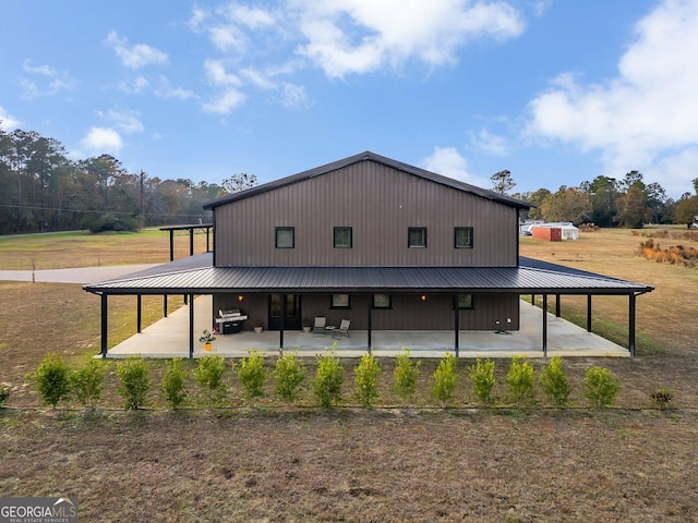 rear view of property featuring a patio