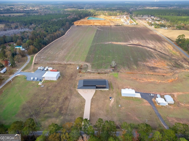 birds eye view of property featuring a rural view