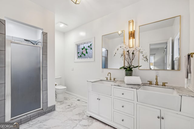 bathroom with vanity, toilet, and walk in shower