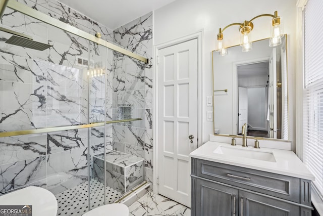 bathroom with vanity, an enclosed shower, and toilet