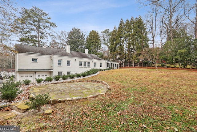 view of yard with a garage