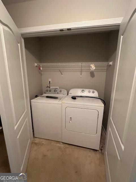 laundry room with washer and dryer and laundry area