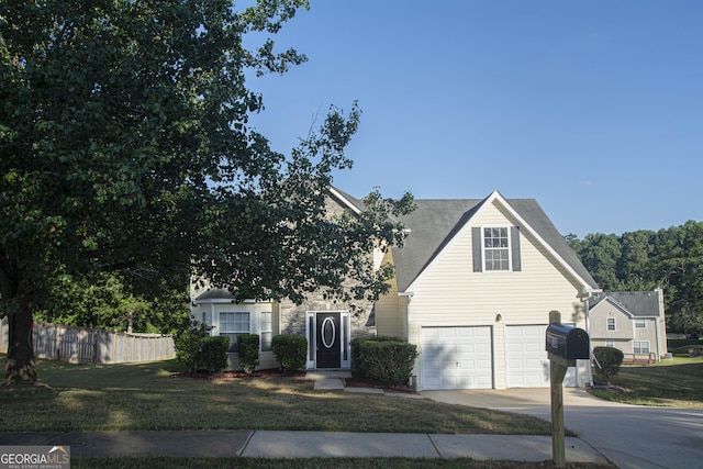 view of front of home featuring a front yard and a garage