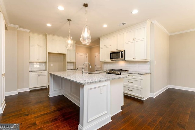 kitchen featuring backsplash, dark wood-style flooring, crown molding, a sink, and stainless steel microwave
