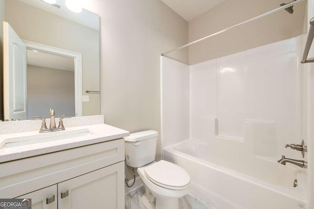 bathroom with tub / shower combination, toilet, and vanity