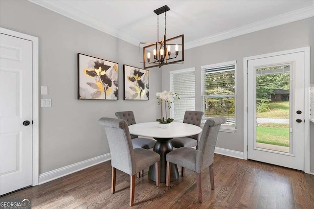 dining space featuring ornamental molding, dark hardwood / wood-style flooring, and a notable chandelier