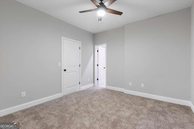 carpeted empty room with ceiling fan