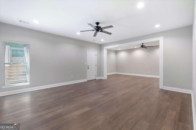 unfurnished room with dark hardwood / wood-style flooring