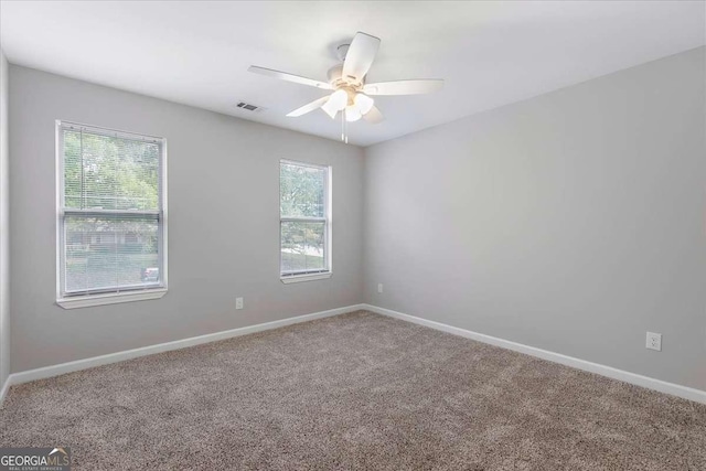 carpeted empty room with ceiling fan