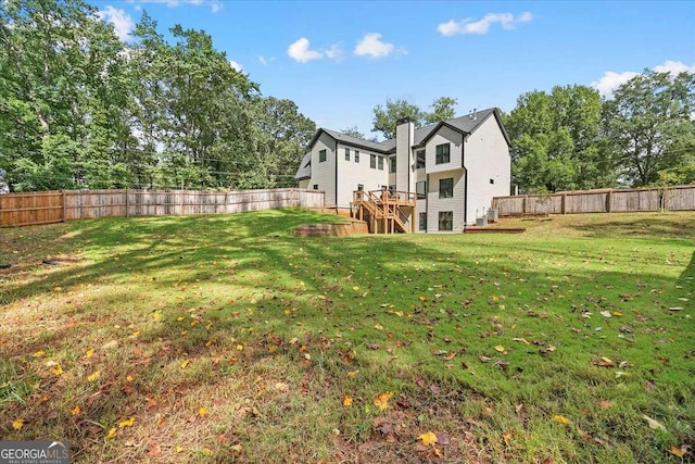 view of yard with a wooden deck