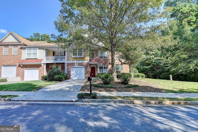 multi unit property with a balcony and a garage