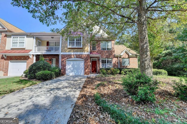 view of front of property with a balcony and a garage