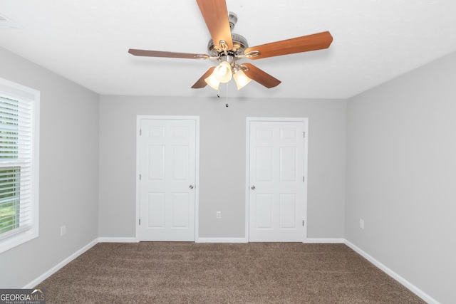 unfurnished bedroom with carpet flooring and ceiling fan