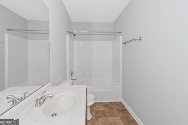 full bathroom with sink, shower / bathing tub combination, and toilet