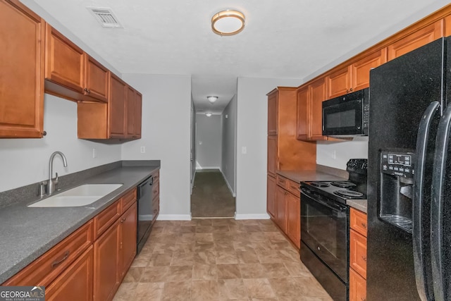 kitchen featuring sink and black appliances