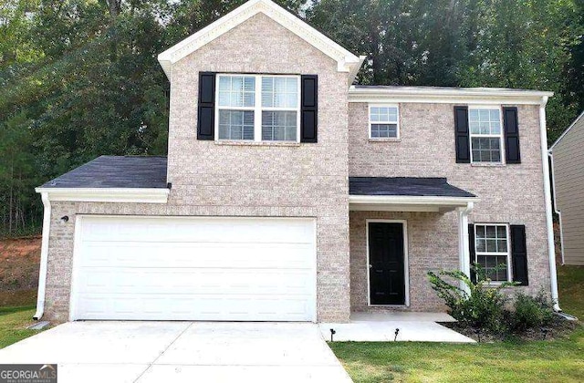 view of front of home with a garage