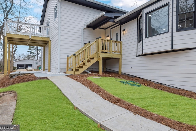 view of exterior entry with a deck